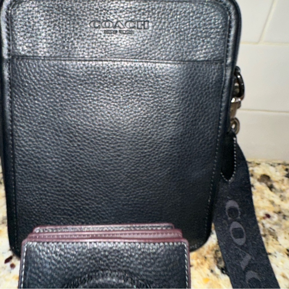 Coach leather cross body bag with coach strap and coach leather wallet.
